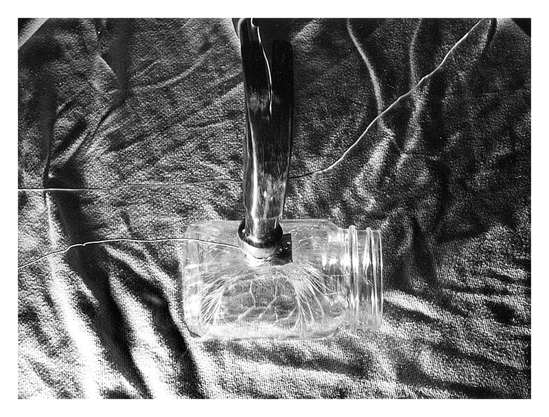 Hammer hitting glass jar